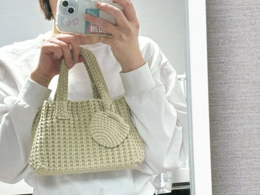 Knit dot bag holding wet wipes