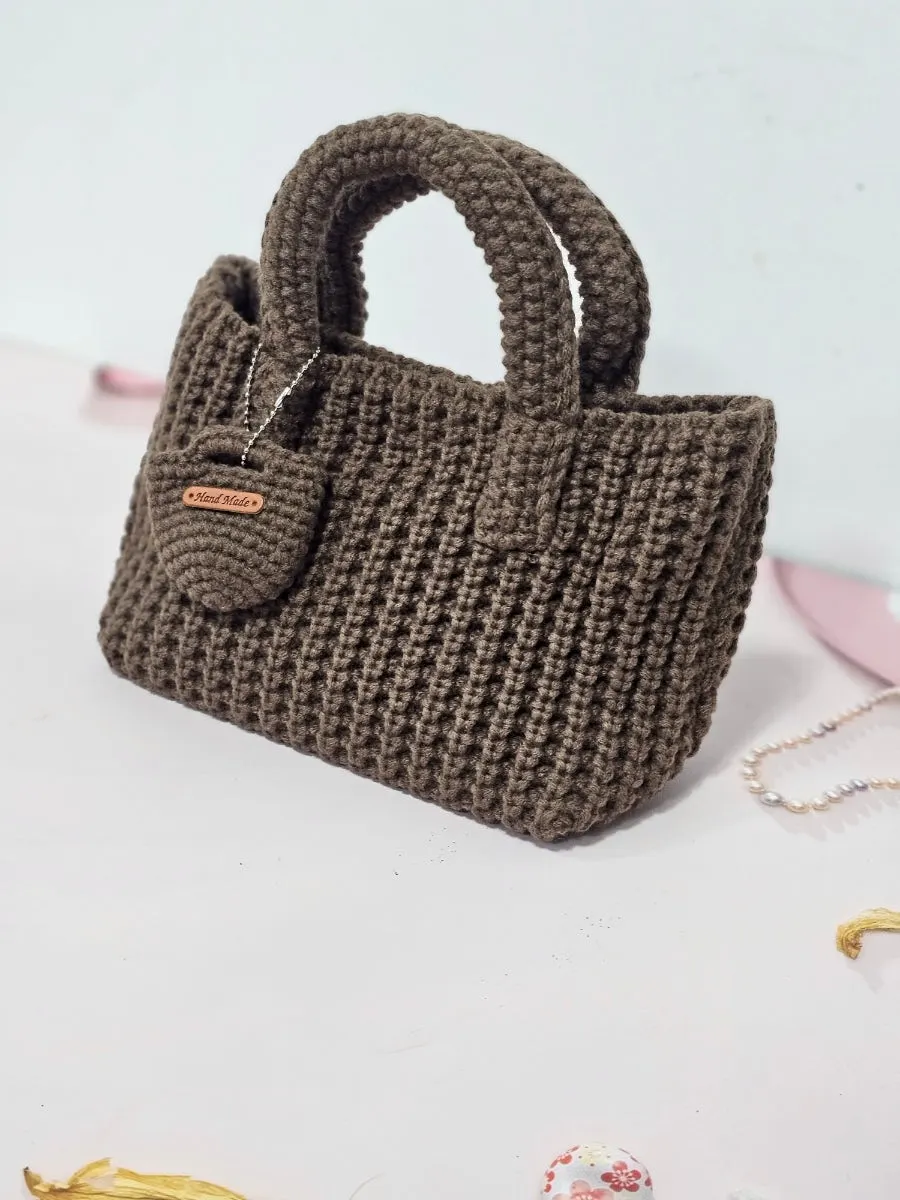 Knit bag paired with substantial winter clothing