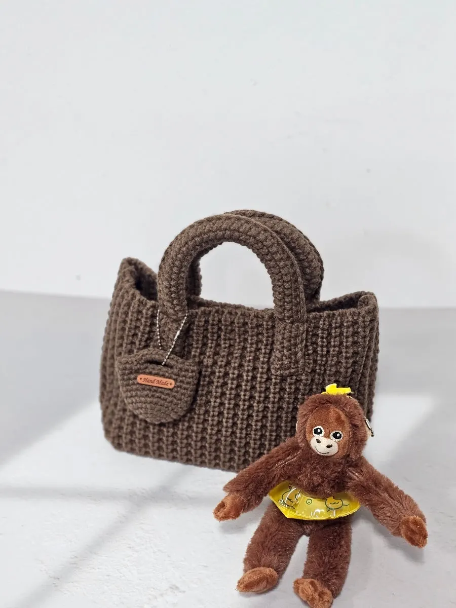 Meda Bag knit bag carried as a tote and shoulder bag