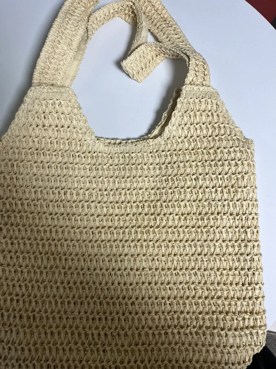 Rattan-style bag styled for spring and summer outfits