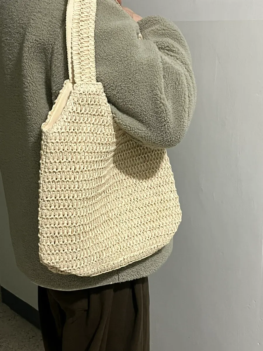 Zipped storage section of a rattan-style bag