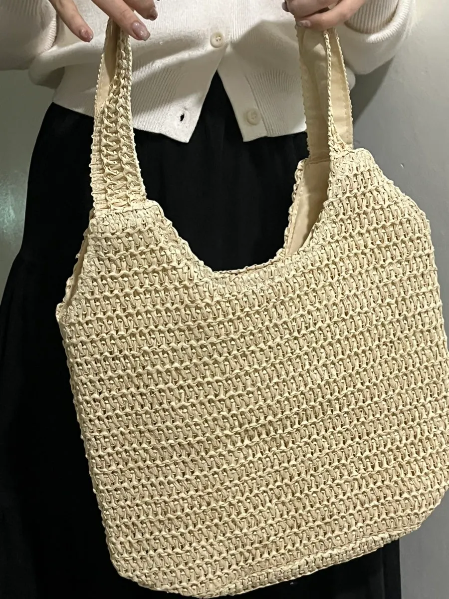 Woven bag styled with winter outerwear