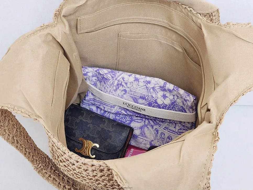 Interior space of the Meda Bag rattan bag holding belongings