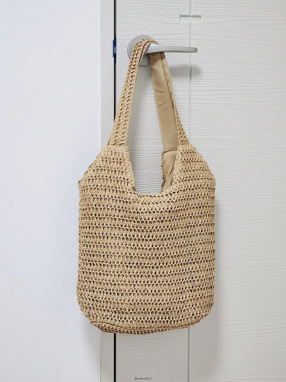 Meda Bag rattan bag worn for an everyday outing