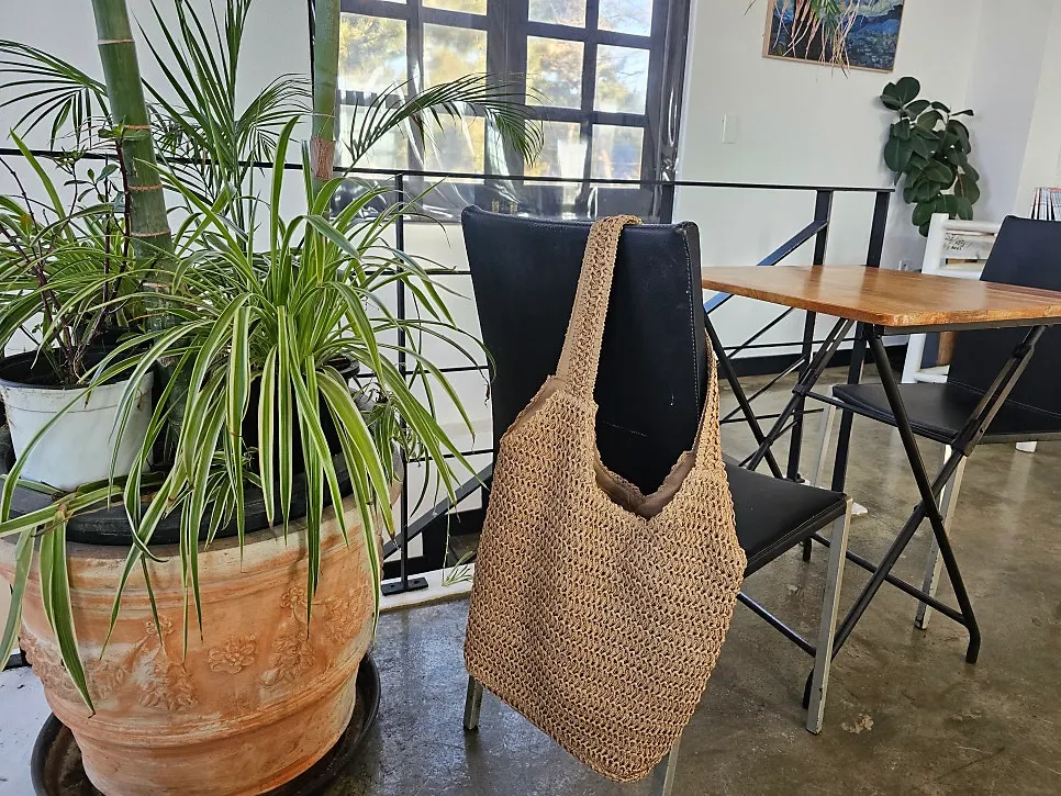 Rattan shoulder bag chosen for travel to a hot country