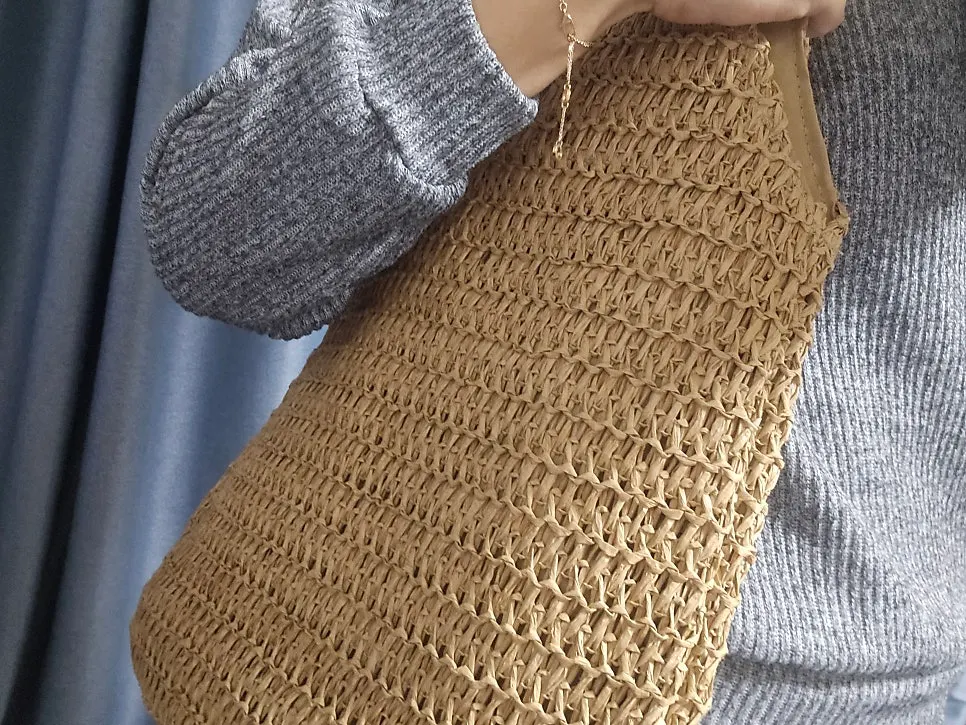 Rattan shoulder bag with a zipper and divided interior storage