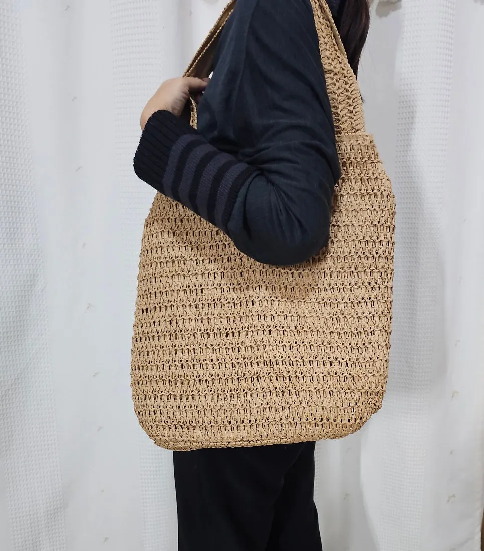 Brown rattan shoulder bag styled with an outfit