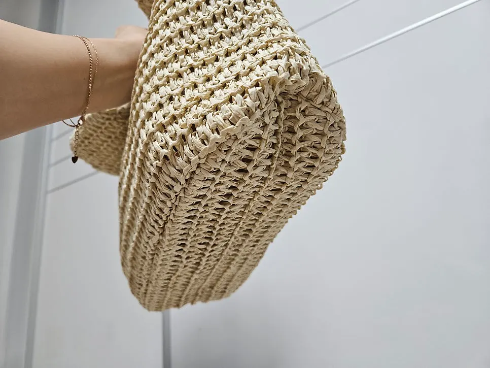 Space inside the rattan bag with the pouch inserted