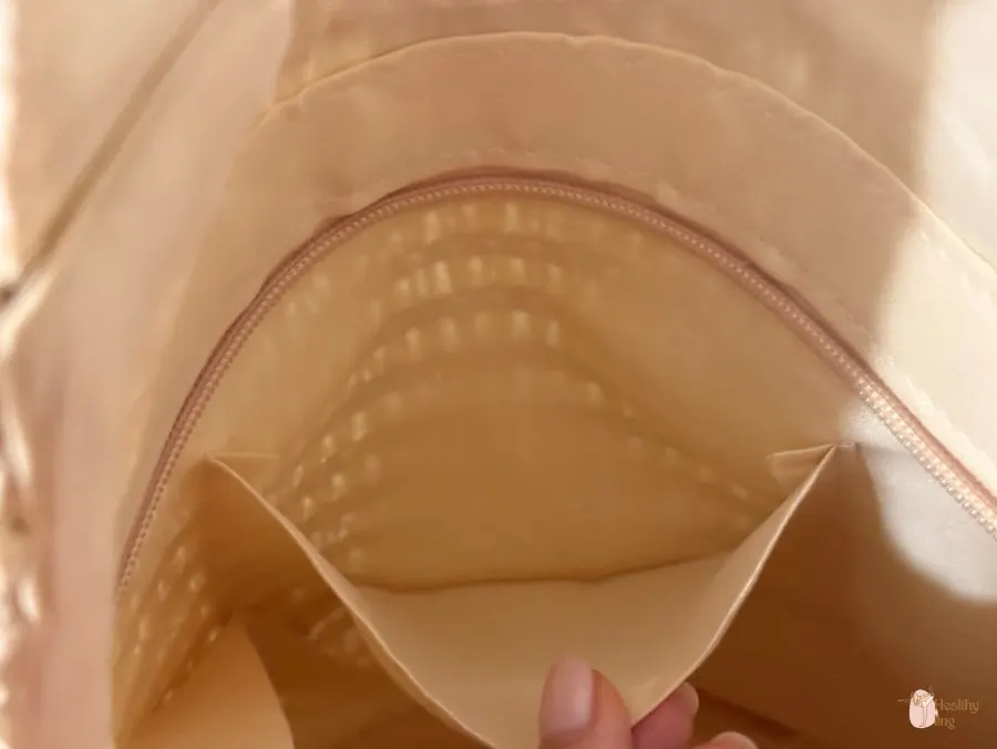 Inside of a rattan bag with a pocket for belongings