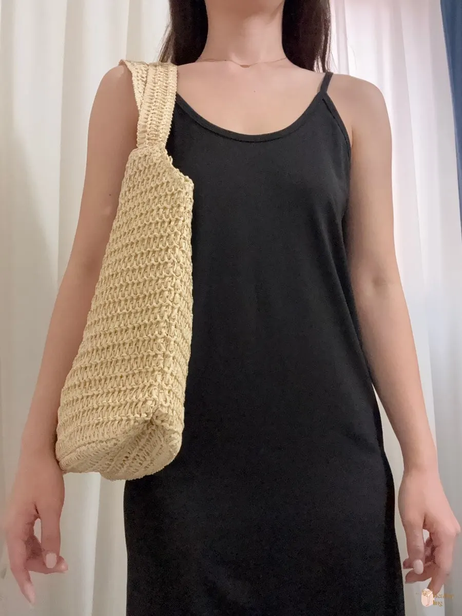 Bright Meda Bag rattan bag paired with a black dress