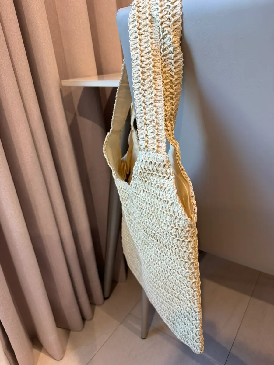 Vertical rattan bag paired with summer clothing
