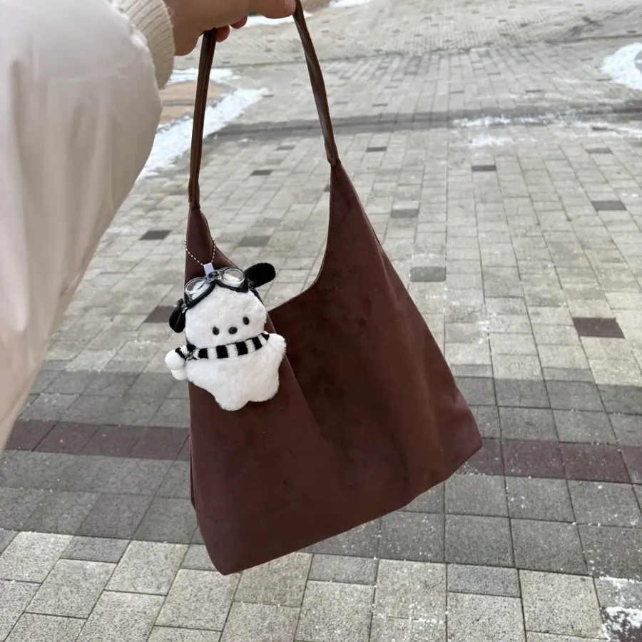A brown suede bag chosen for going out