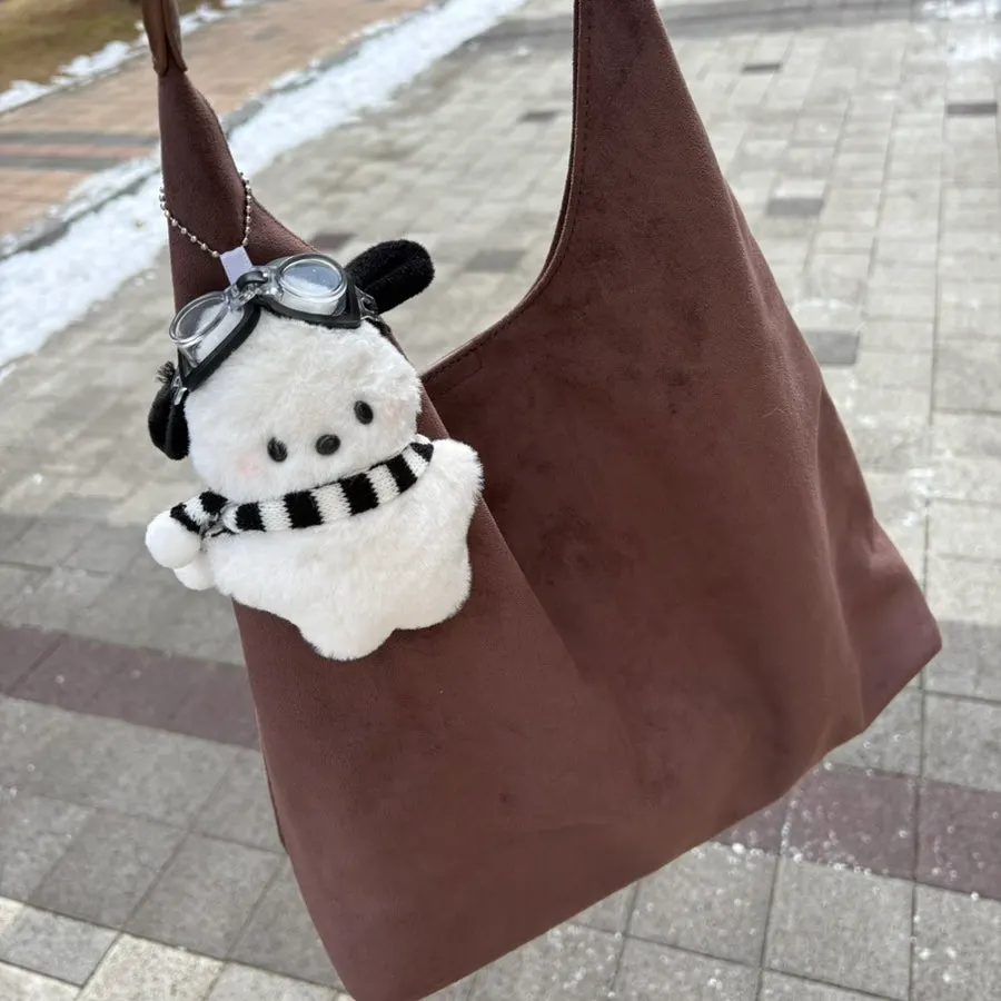 A brown suede bag carried out in winter