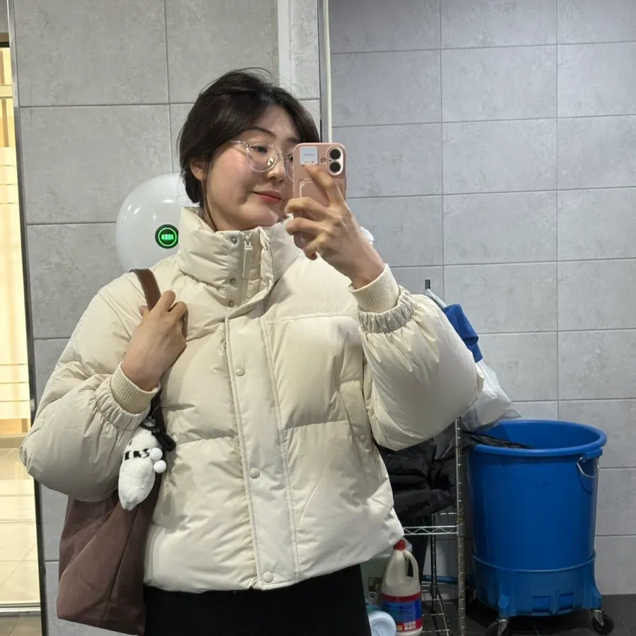 Carrying a brown suede shoulder bag