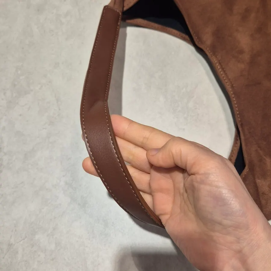 Stitching finish on the Meda Bag suede shoulder bag