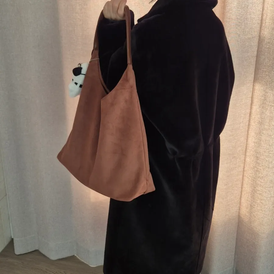 Meda Bag suede bag coordinated with an outfit for going out