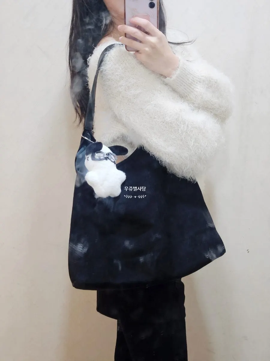 Black suede bag paired with an everyday outfit