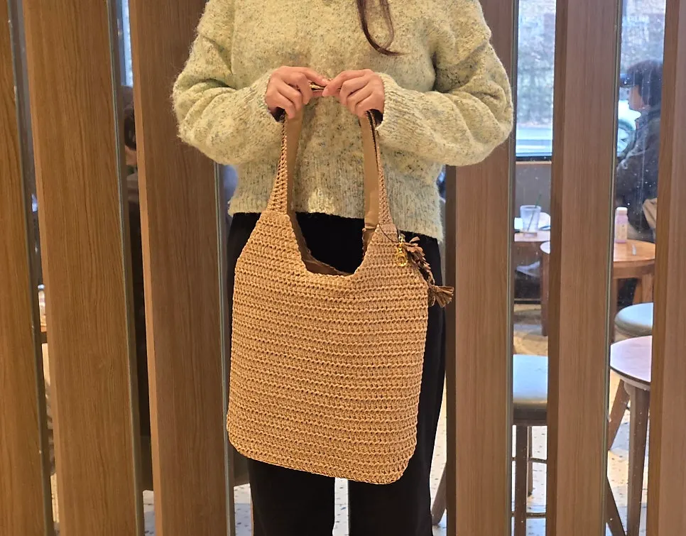 Meda Bag shoulder bag holding an iPad and keyboard