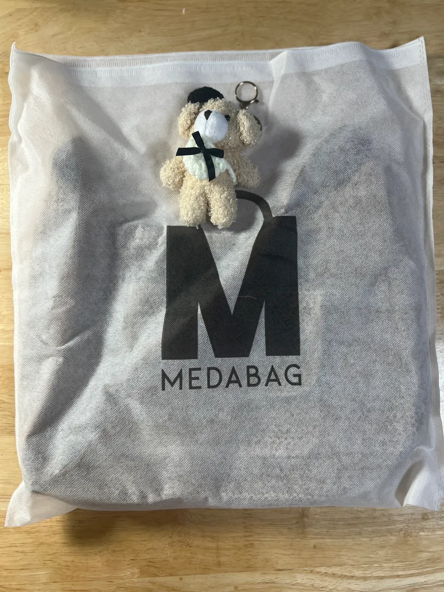 Exterior of a brown Meda Bag rattan crossbody bag