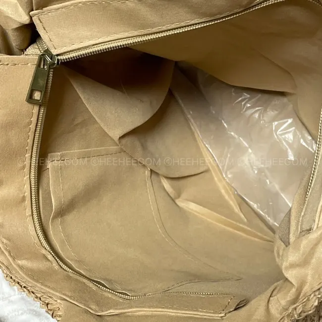 Rattan bag with a zip closure