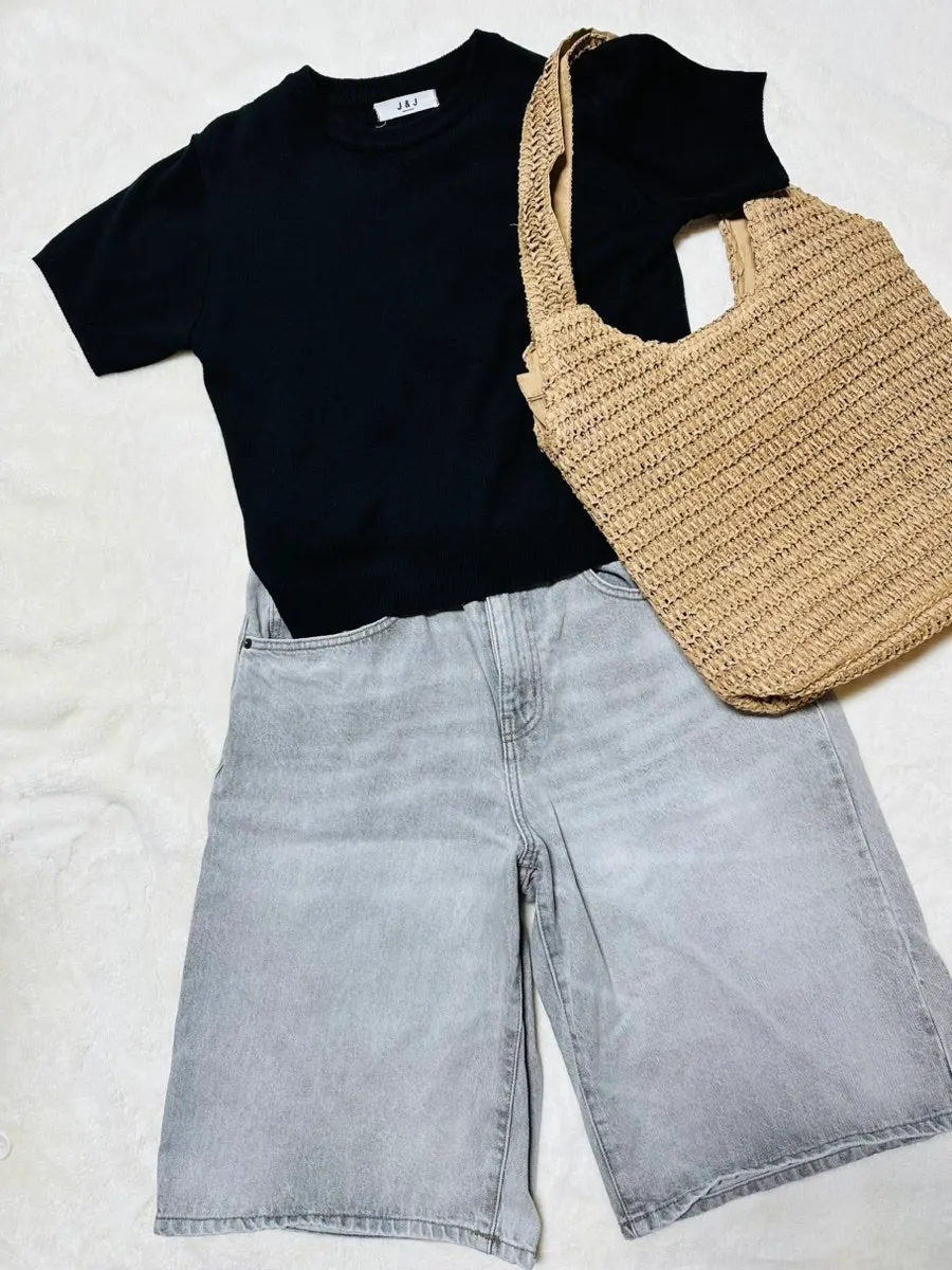 Rattan shoulder bag paired with a dress