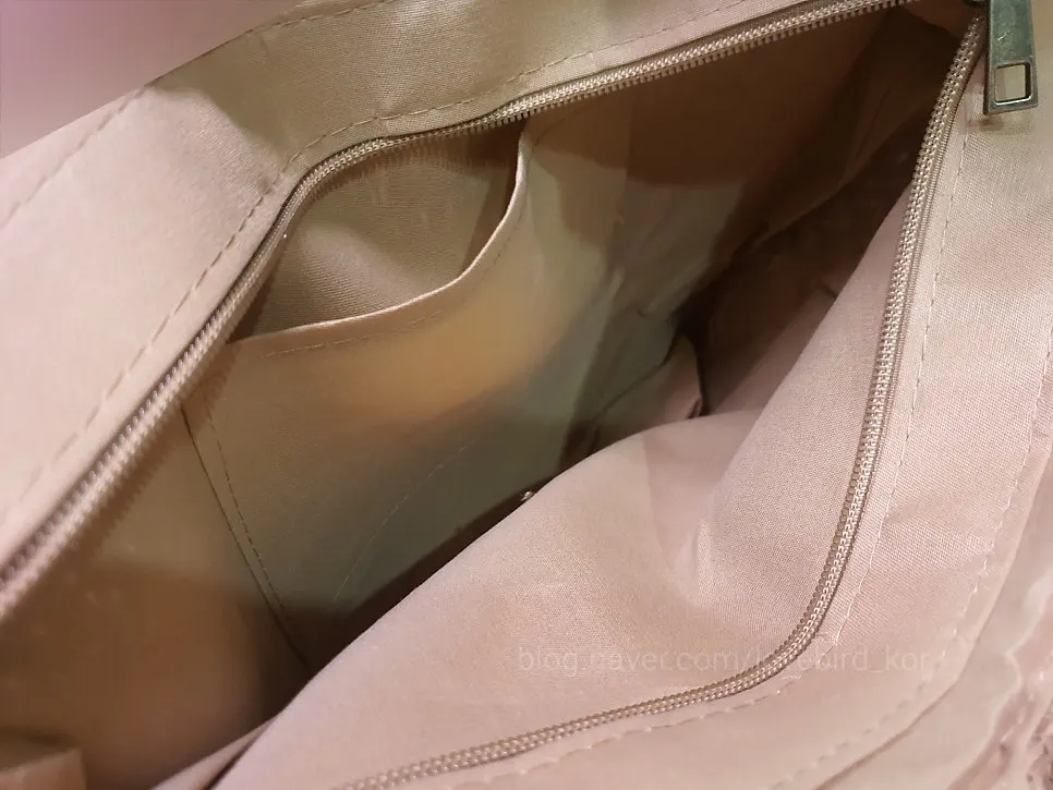 Large-capacity rattan bag holding travel belongings