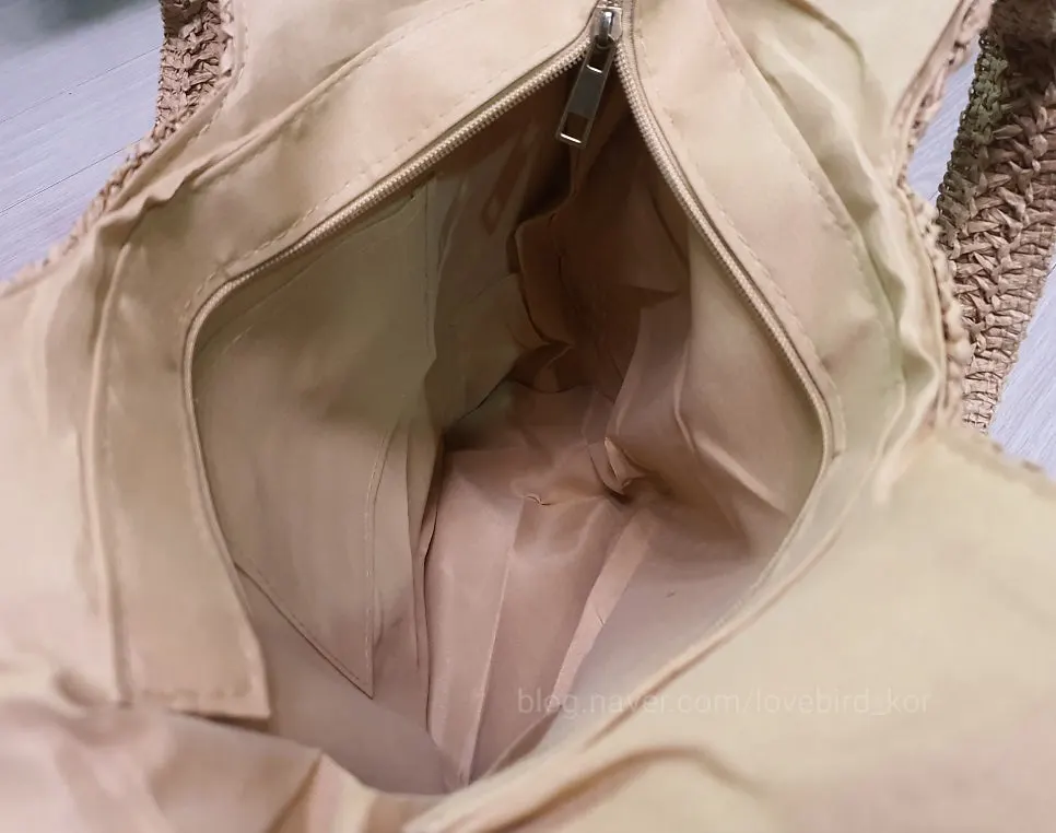 Inside of a rattan bag with an inner pocket