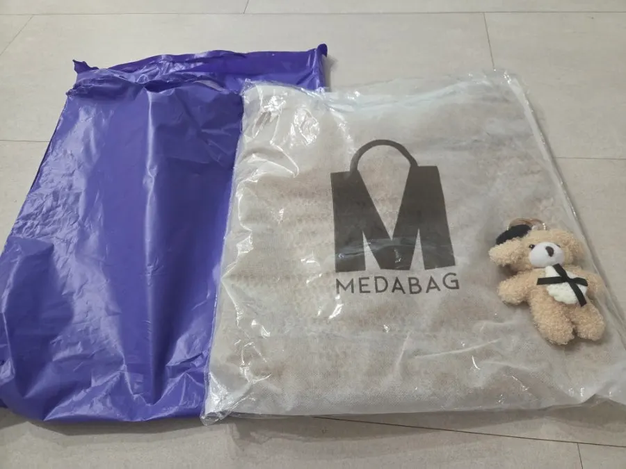 Meda Bag shoulder bag with a rattan-like weave