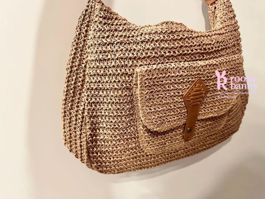 Medabag rattan crossbody bag used as a summer travel bag