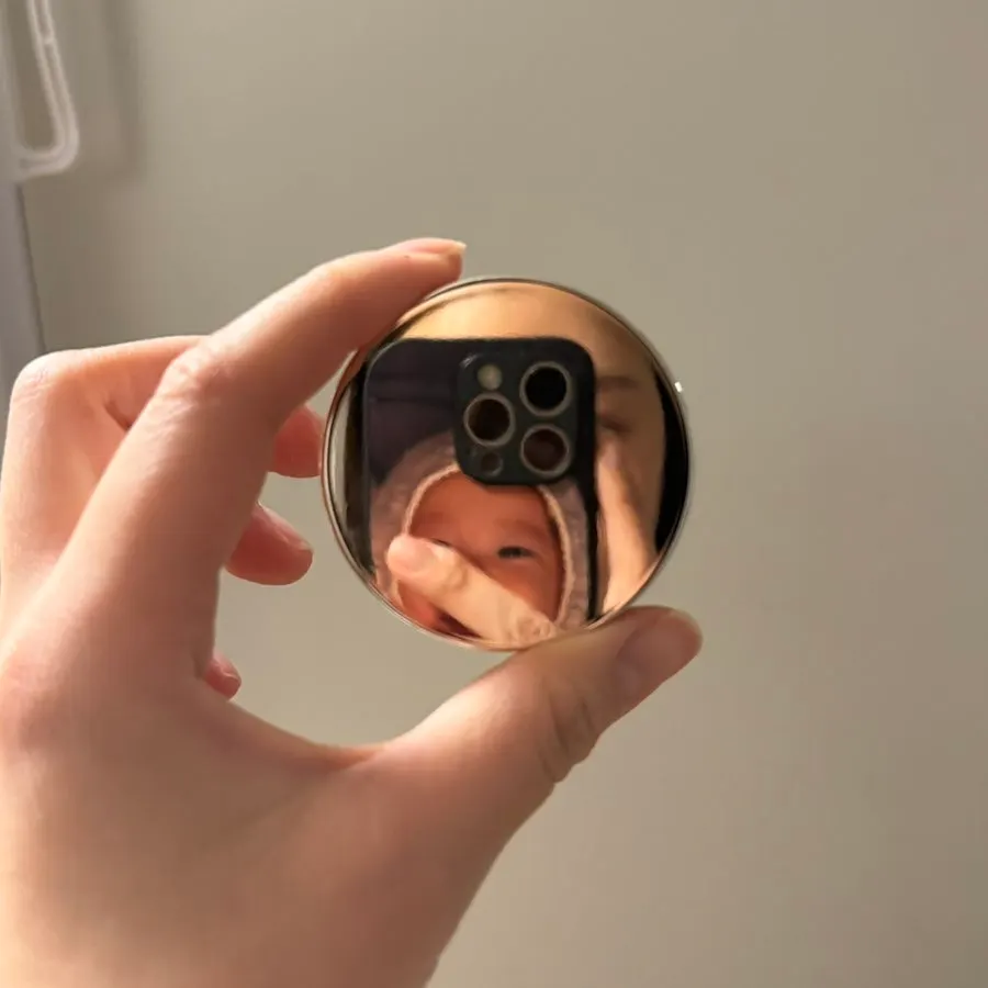Cream lid used as a mirror