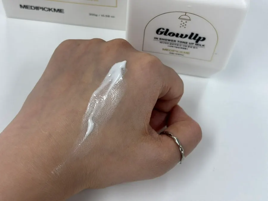 Applying tone-up milk to skin