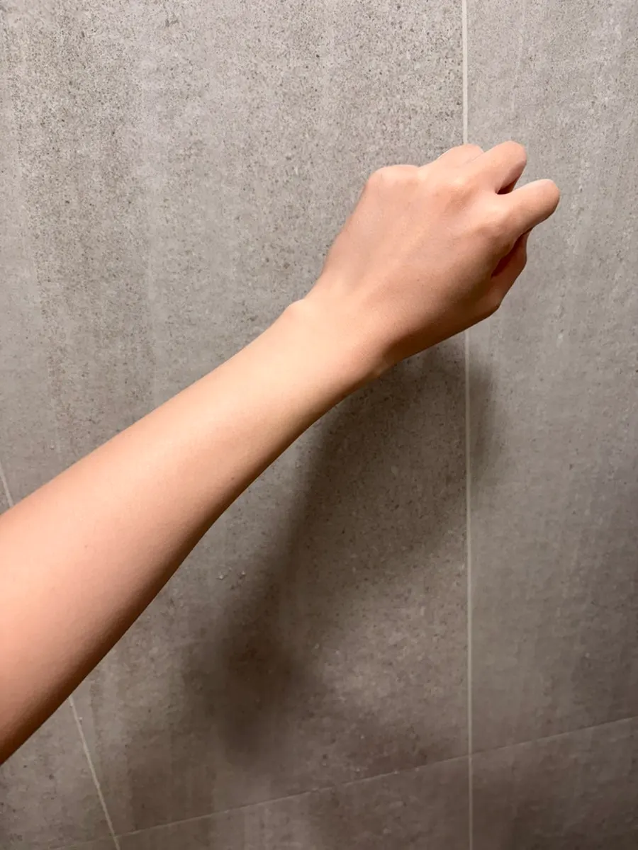 Before-and-after comparison of tone-up milk on an arm