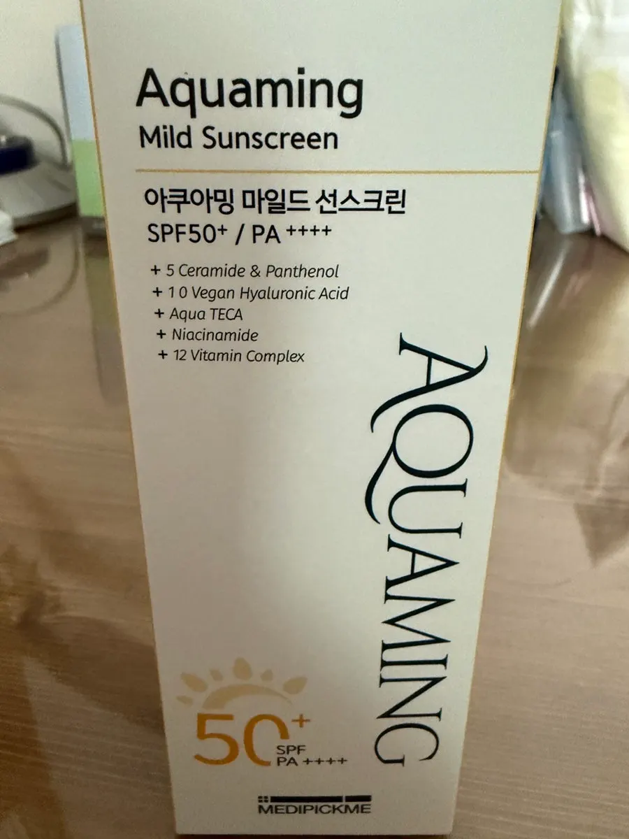 Thin, watery sunscreen texture dispensed on the back of a hand