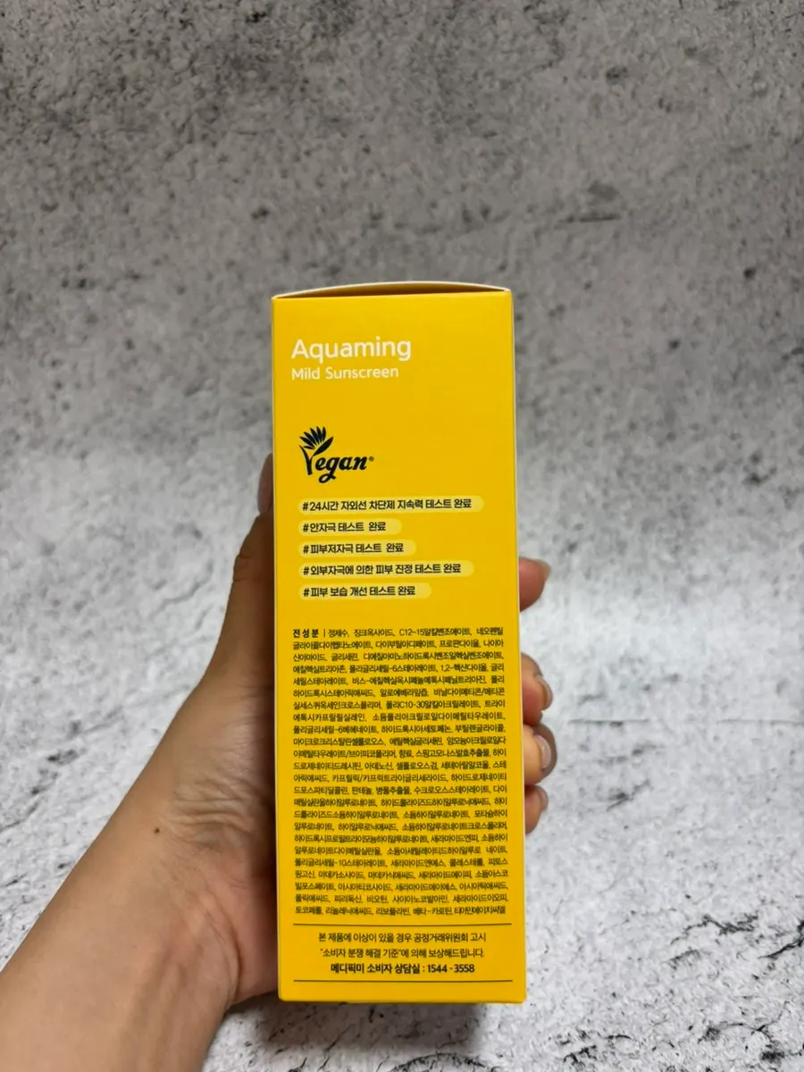 Aquaming Mild Sunscreen standing upright
