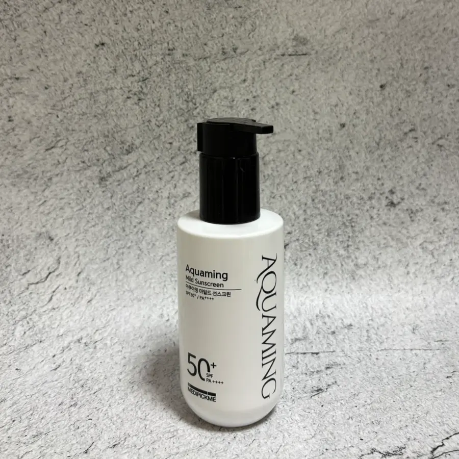 Hydrating sunscreen texture swatched on the back of a hand