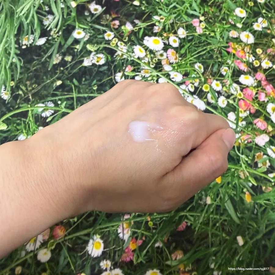 Cream texture applied to the back of a hand