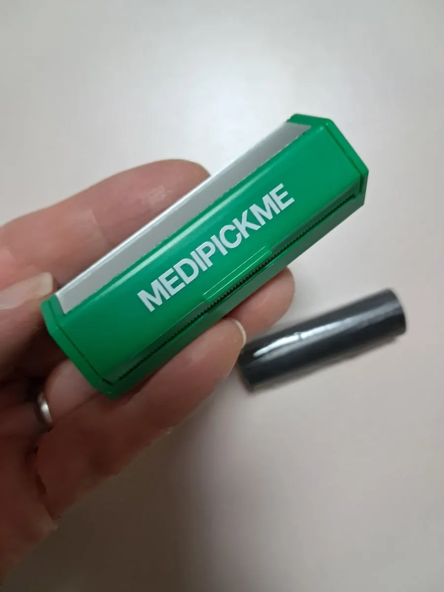 Portable roll-style oil blotting paper components