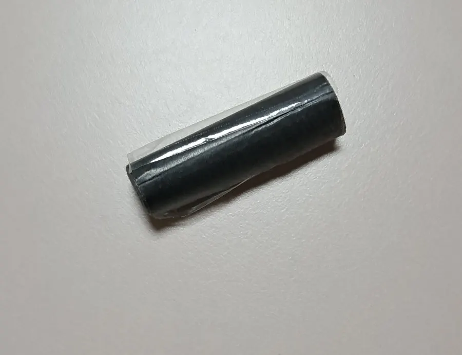 Using oil blotting paper for a makeup touch-up
