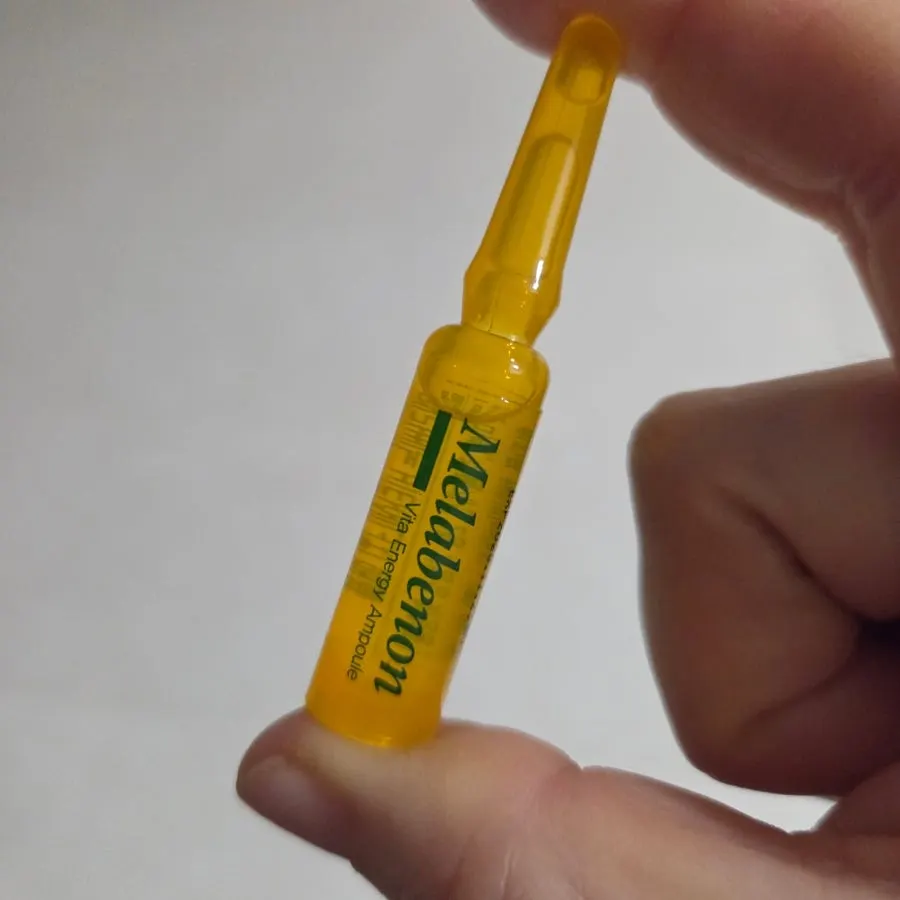 Opened ampoule container and its contents