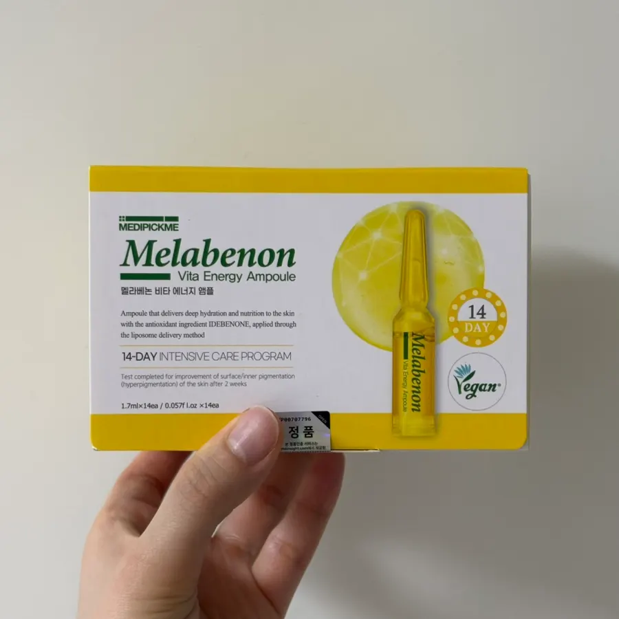 Ampoule product box held in one hand