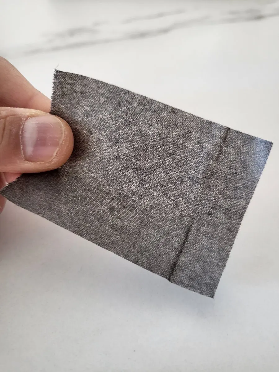Roll blotting paper used to tidy oil over makeup