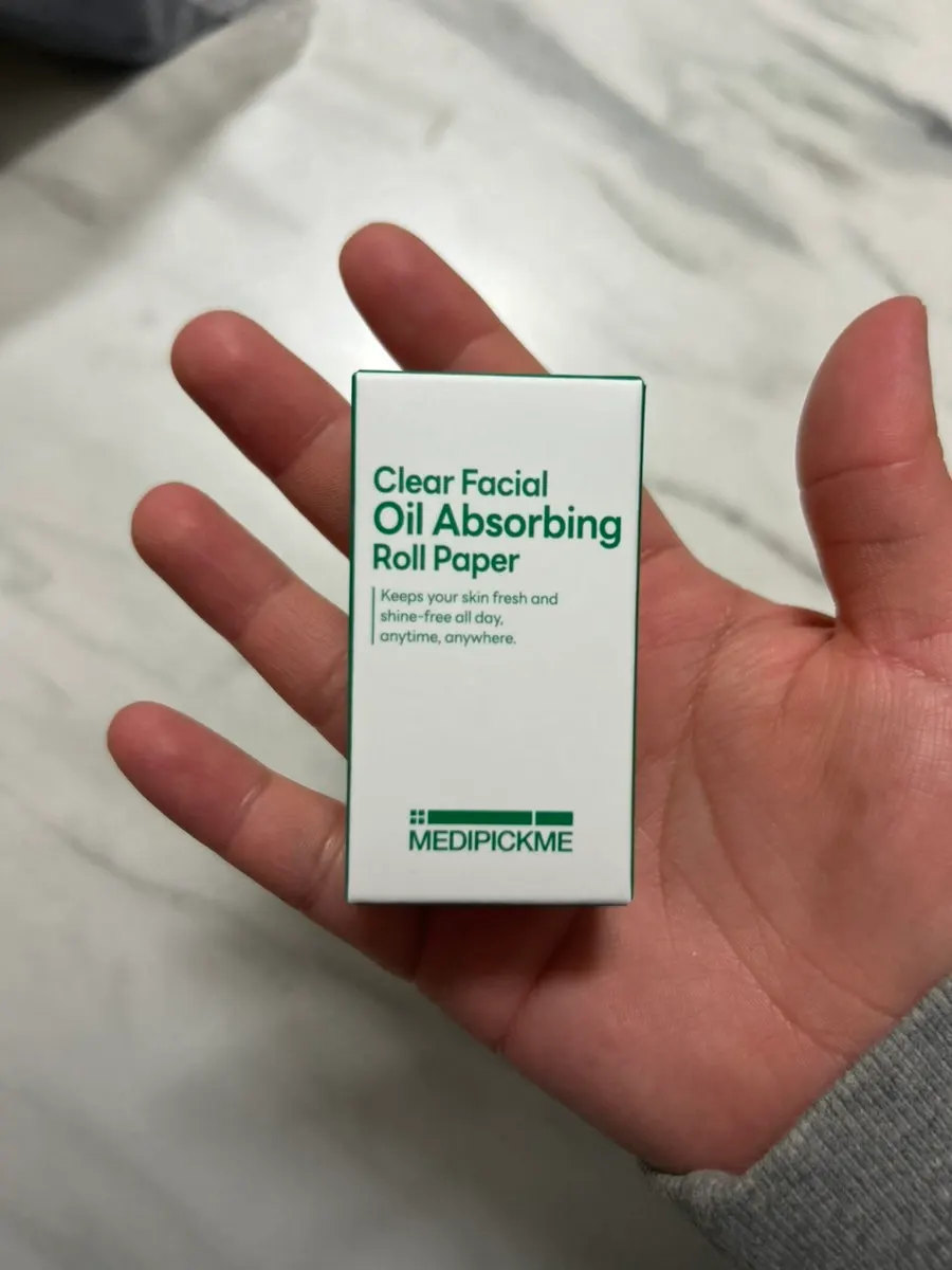 Roll blotting paper used by rolling it over the face