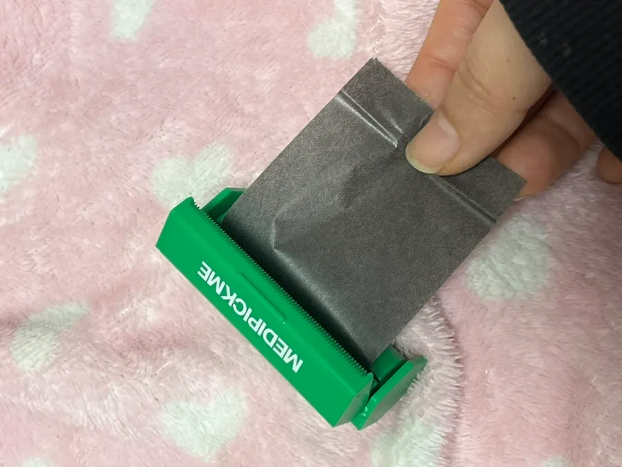 Roll oil blotting paper in a hard case