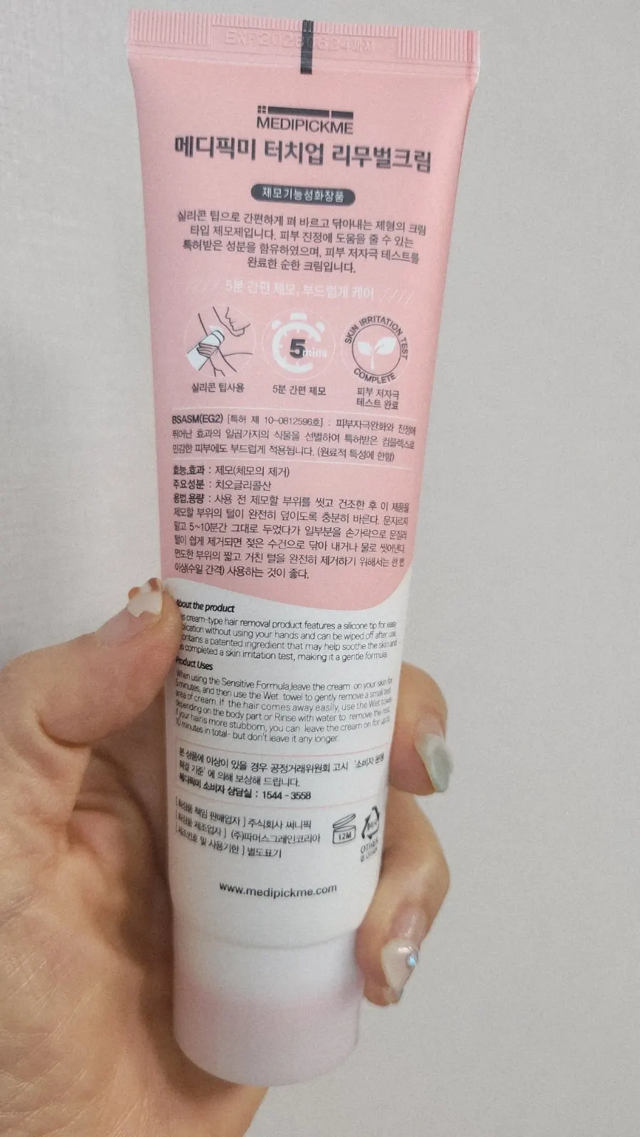 Spreading the hair removal cream on arms and legs