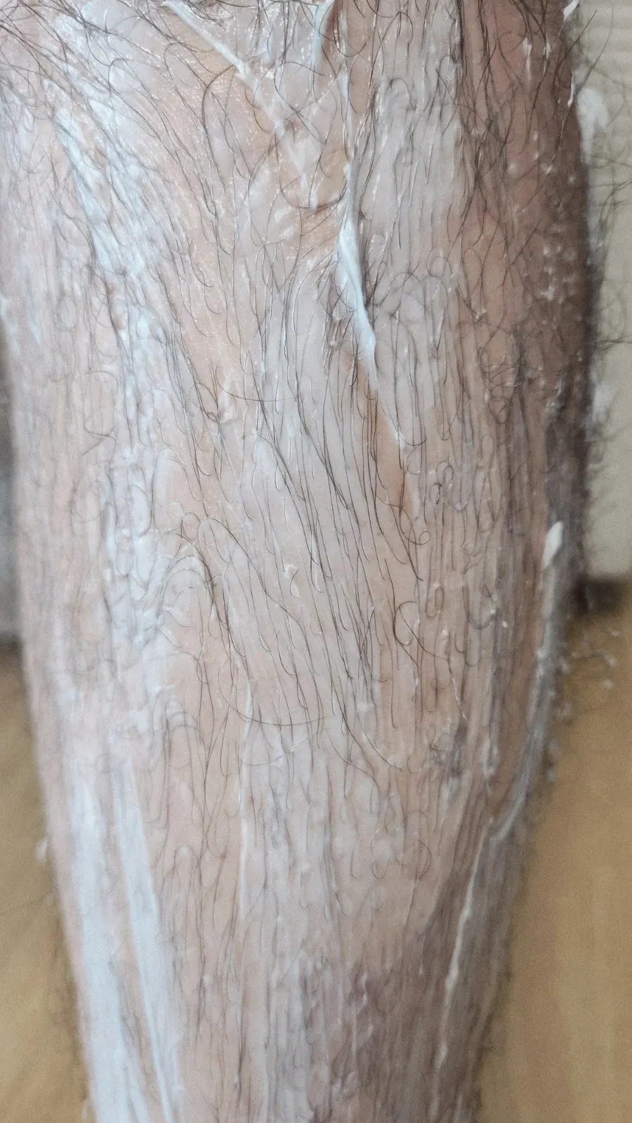 Hair removal cream product shot showing thioglycolic acid content