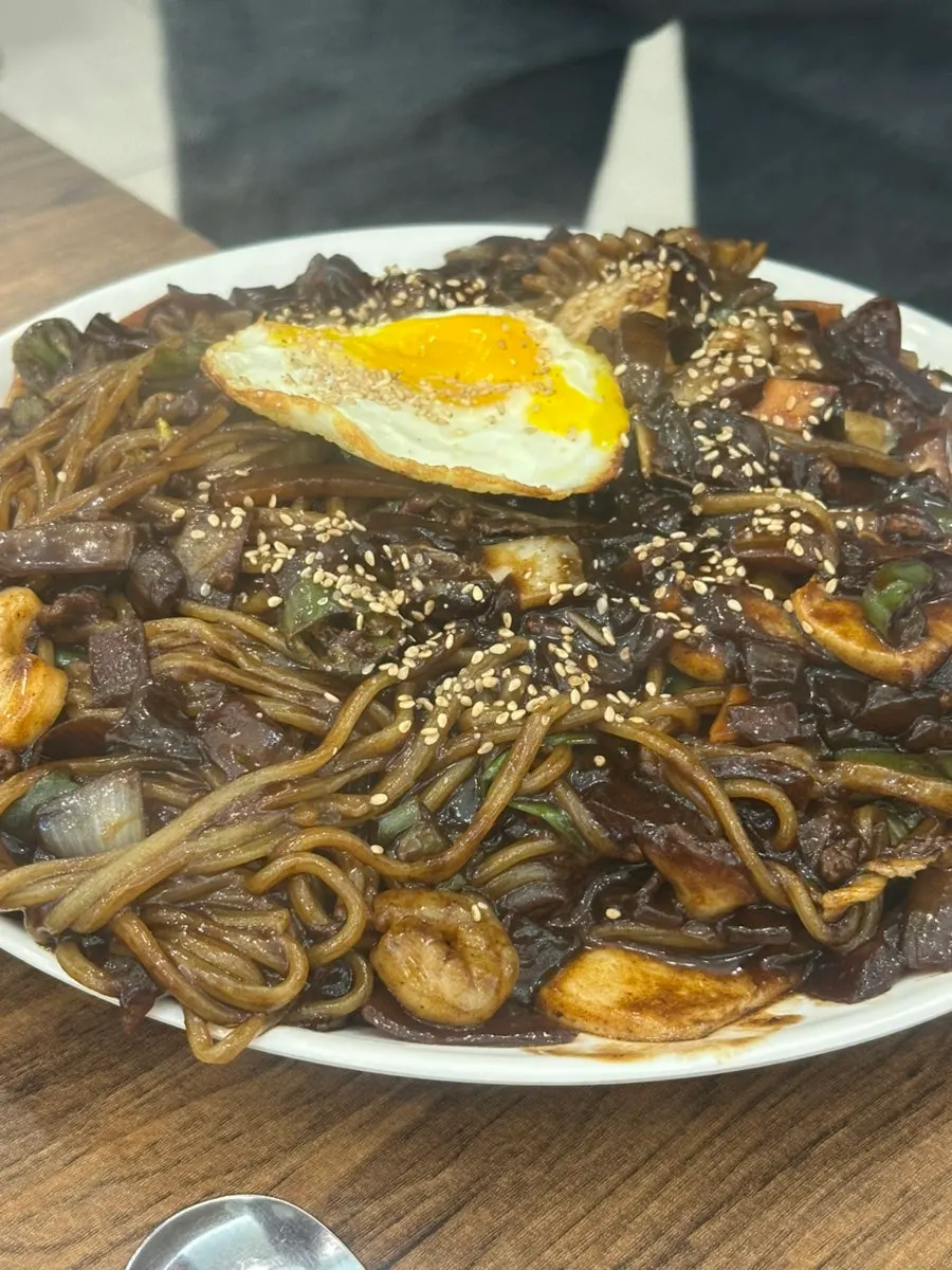 Stone-griddle jjajang placed on the heated griddle