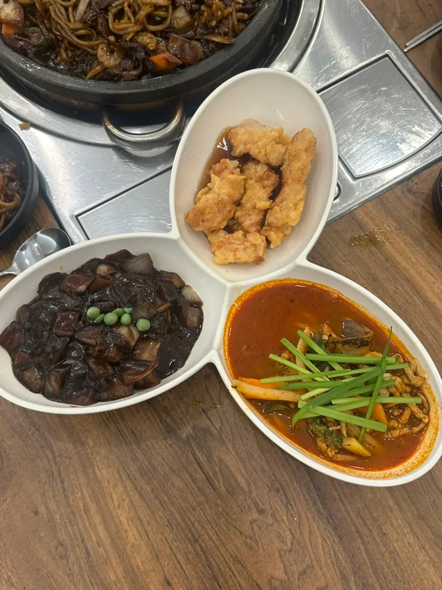 Rice mixed with leftover jjajang sauce and corn macaroni