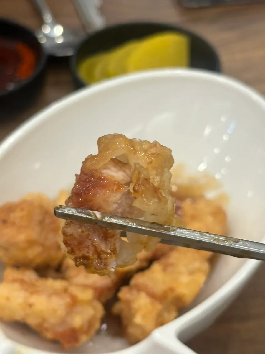 Cross-section of thick tangsuyuk with sauce