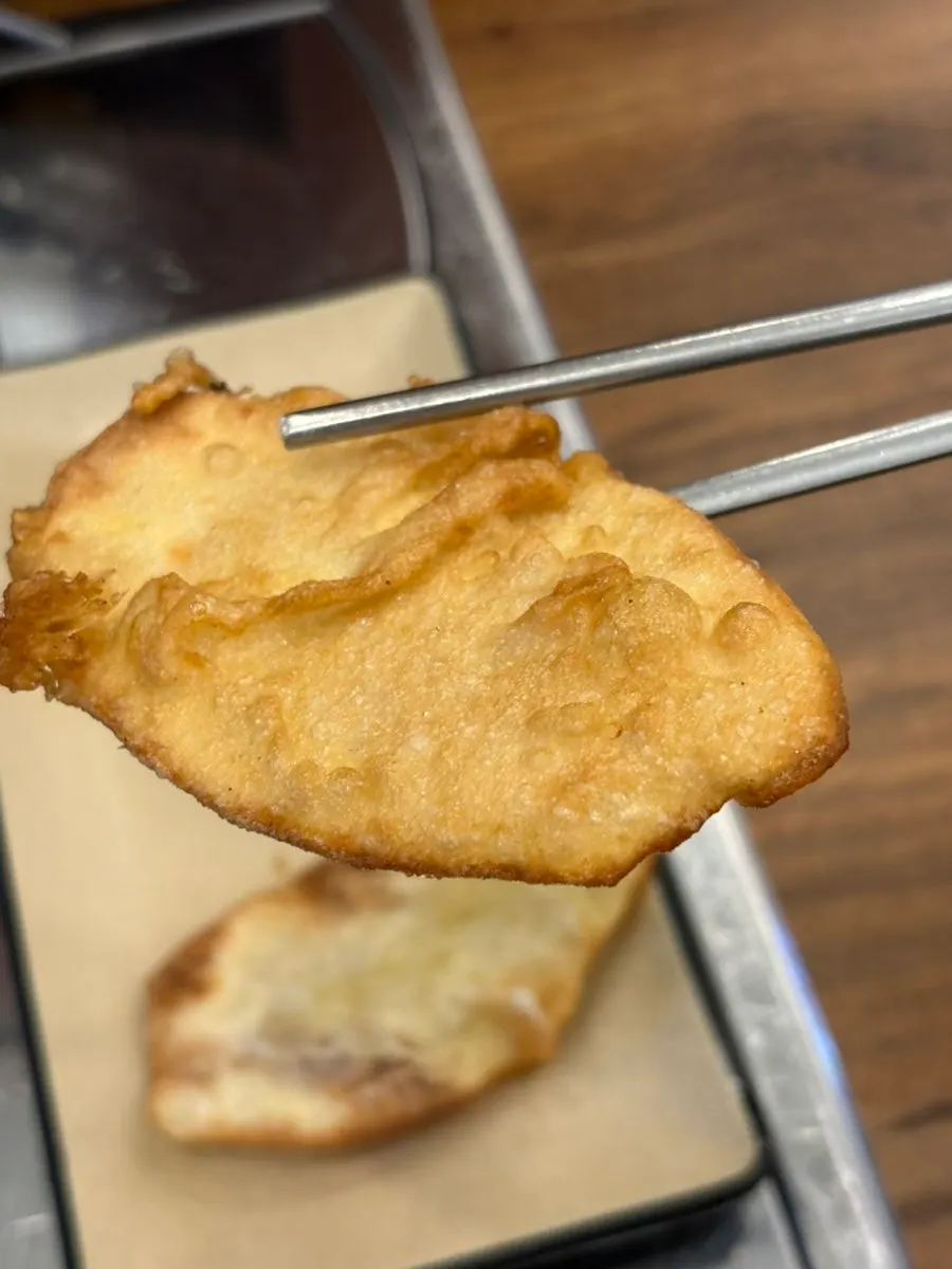 Thin sweet potato fritters served as a default side