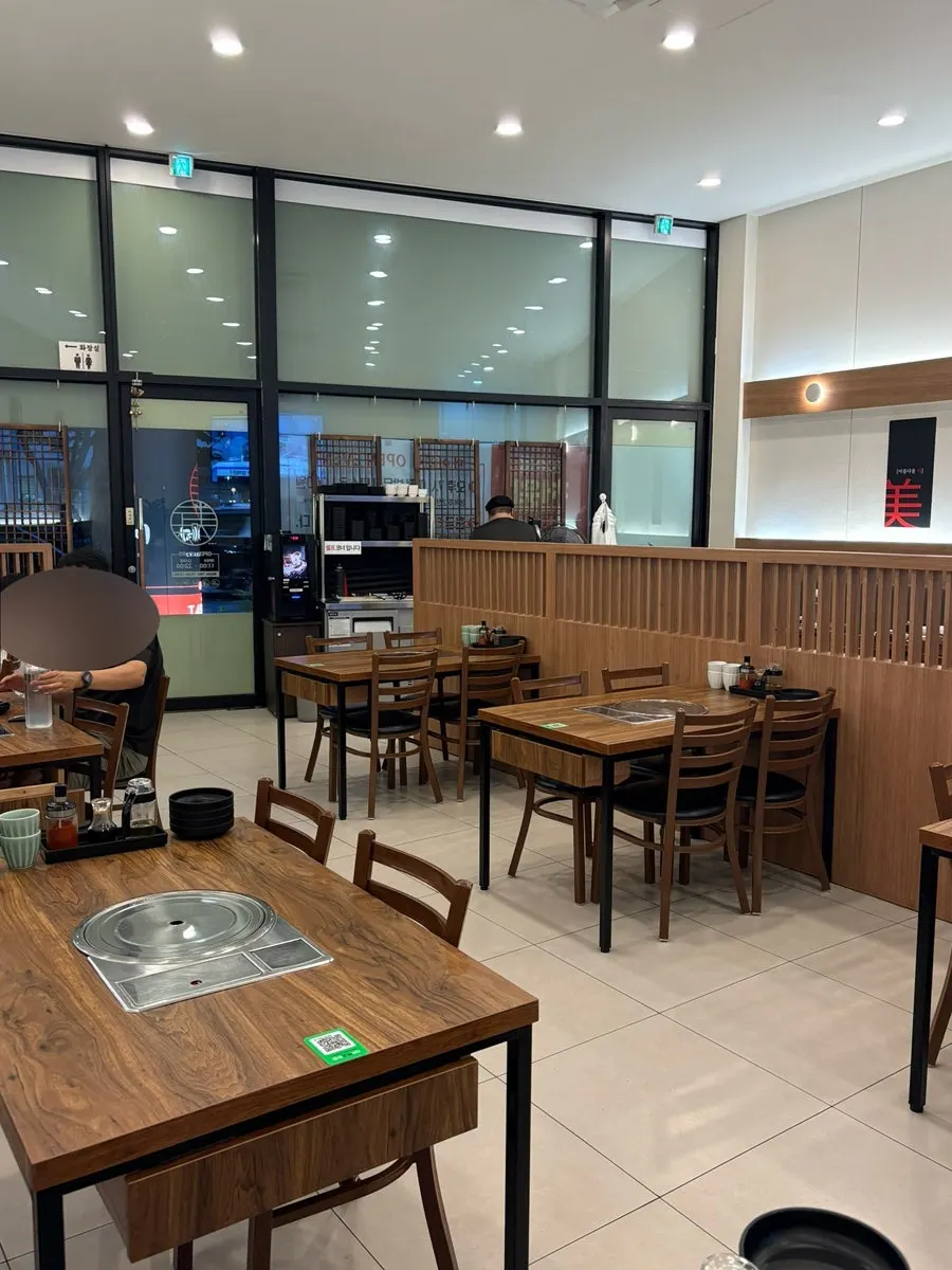Wood-toned interior tables inside Mayway